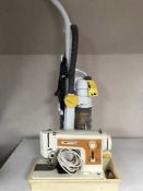 A Fristar Rossmann 45 mark III sewing machine in case together with a Zanussi vac