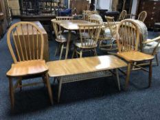 An elm Ercol coffee table and a pair of Ercol kitchen chairs