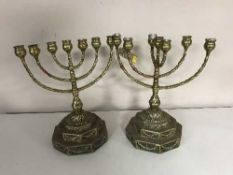 A pair of decorative brass menorah