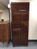 A shaped double door cabinet with lacquered doors