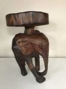 A carved elephant stool
