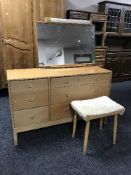 A mid 20th century six drawer dressing chest and stool