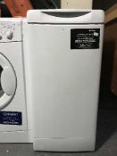 A Hotpoint Slimline top loading washing machine.