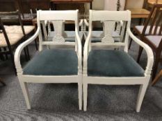 Four white painted armchairs