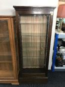 An early 20th century mahogany glazed door display cabinet