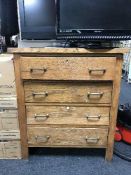 An early 20th century oak three drawer chest