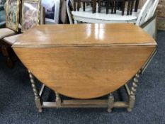 An oak barley twist table and four chairs