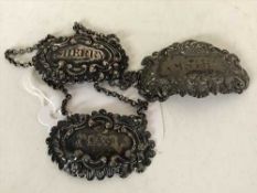 Three silver decanter labels; Port,