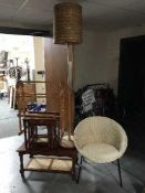 A wicker basket chair, teak standard lamp, pine towel rail,