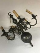 A decorative metal six branch chandelier