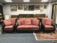 A fine quality Edwardian carved mahogany three-piece bergere lounge suite comprising a three-seater