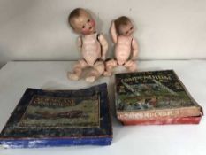 A basket of two vintage bisque headed dolls,