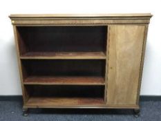 A set of mahogany open shelves fitted a cupboard
