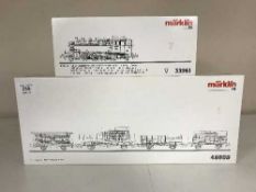 A Marklin 33961 steam locomotive together with a 48808 old timer freight car set (HO Scale),