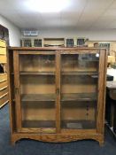 An oak sliding door library bookcase