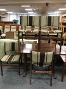 A rosewood effect dining table and four teak chairs