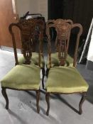 A set of Victorian inlaid mahogany dining chairs