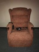 An electric reclining armchair