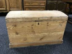 A stripped pine domed top trunk