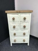 A painted pine multi drawer chest