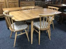 A six-piece elm Ercol dining room suite