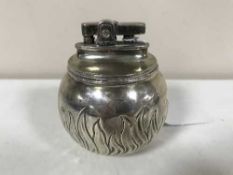A silver Rolstar table lighter