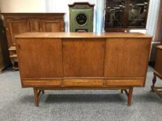 A mid 20th century teak sideboard