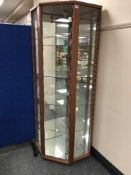 A glazed door corner display cabinet