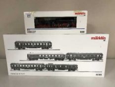 A Marklin 33099 steam locomotive together with a 42765 Express Train Passenger Car Set (HO Scale),