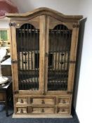 A pine arched topped drinks cabinet