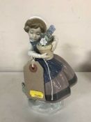 A Lladro figure - girl with flower pot