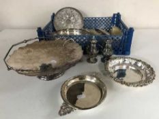 A crate containing a quantity of silver plated wares; swing-handled bowl, dressing table set,