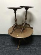 A circular mahogany pedestal lamp table and pair of wine tables