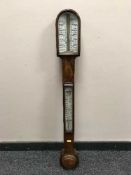 A 19th Century walnut stick barometer.