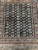 A Persian Bokhara rug on blue ground 1.90 x 1.