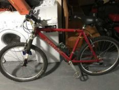 A Gent's Cannondale mountain bike with bike accessories and a car cycle carrier