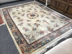 A Chinese carpet on cream ground 376cm by 276cm