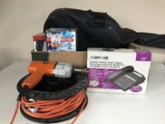 A box of submersible pump, digital radios, drill, acoustic guitar,