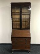 An Edwardian mahogany bureau bookcase