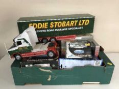 A box of assorted box vehicles and a large Eddie Stobart RC truck