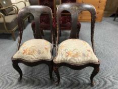 A pair of painted mahogany spoon back chairs