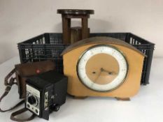 A crate of walnut mantel clock, cameras, sewing box,