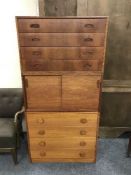 Two four drawer teak chests of drawers and sliding door cupboard