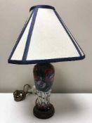 A modern Moorcroft table lamp, depicting roses,