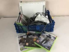 An XBox 360 console with six games,