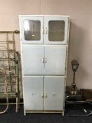 A painted mid 20th century kitchen cabinet