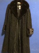 A vintage black lady's coats - Persian lamb with mink trimmings.
