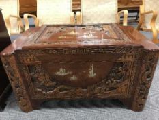 A carved camphor wood box with brass inlay