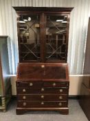 A mahogany Regency style bureau bookcase