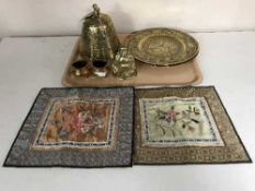 A tray of large brass Eastern bell, wall plaques, Buddha figure etc.